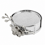 Elevate your tabletop with the White Orchid Drink Coaster Set. Handcrafted with sculpted orchid details in luminous white nickel, each coaster embodies purity, grace, and the serene beauty of new beginnings.
Delicate yet enduring, this set protects your surfaces while adding an artful, luxurious touch to any gathering. Part of the Orchid Collection, it reflects Michael Aram’s meticulous craftsmanship and timeless design.