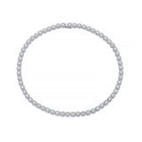 A tennis necklace made of small round-cut diamonds set in a silver-toned metal, arranged in a perfect circle on a solid white background.