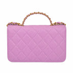 A light pink quilted leather handbag with a gold chain handle and gold-tone hardware, shown against a plain white background.