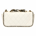 A quilted white leather shoulder bag with a snakeskin-patterned woven strap and gold-tone hardware, shown against a plain white background.