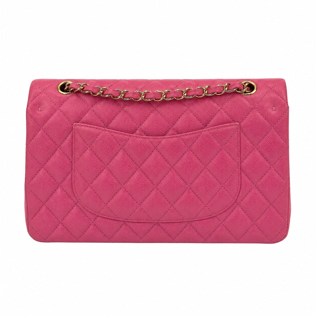 A pink quilted leather shoulder bag with a gold-tone chain strap, shown against a plain white background.