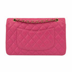 A pink quilted leather shoulder bag with a gold-tone chain strap, shown against a plain white background.