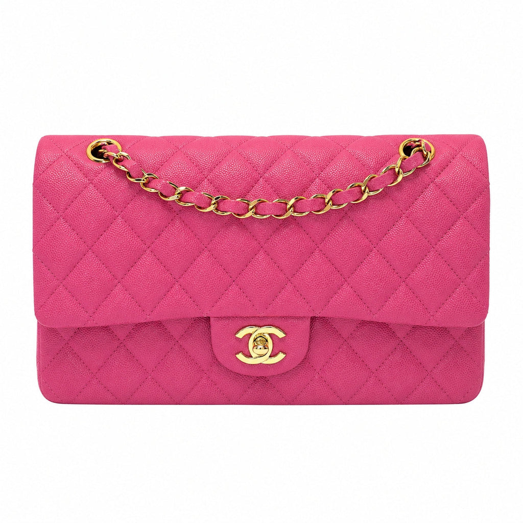 A Chanel Classic Flap handbag in vibrant pink quilted leather with gold-tone hardware, featuring a diamond-quilted pattern, a top flap, and a gold interlocking CC turn-lock closure on a plain white background.