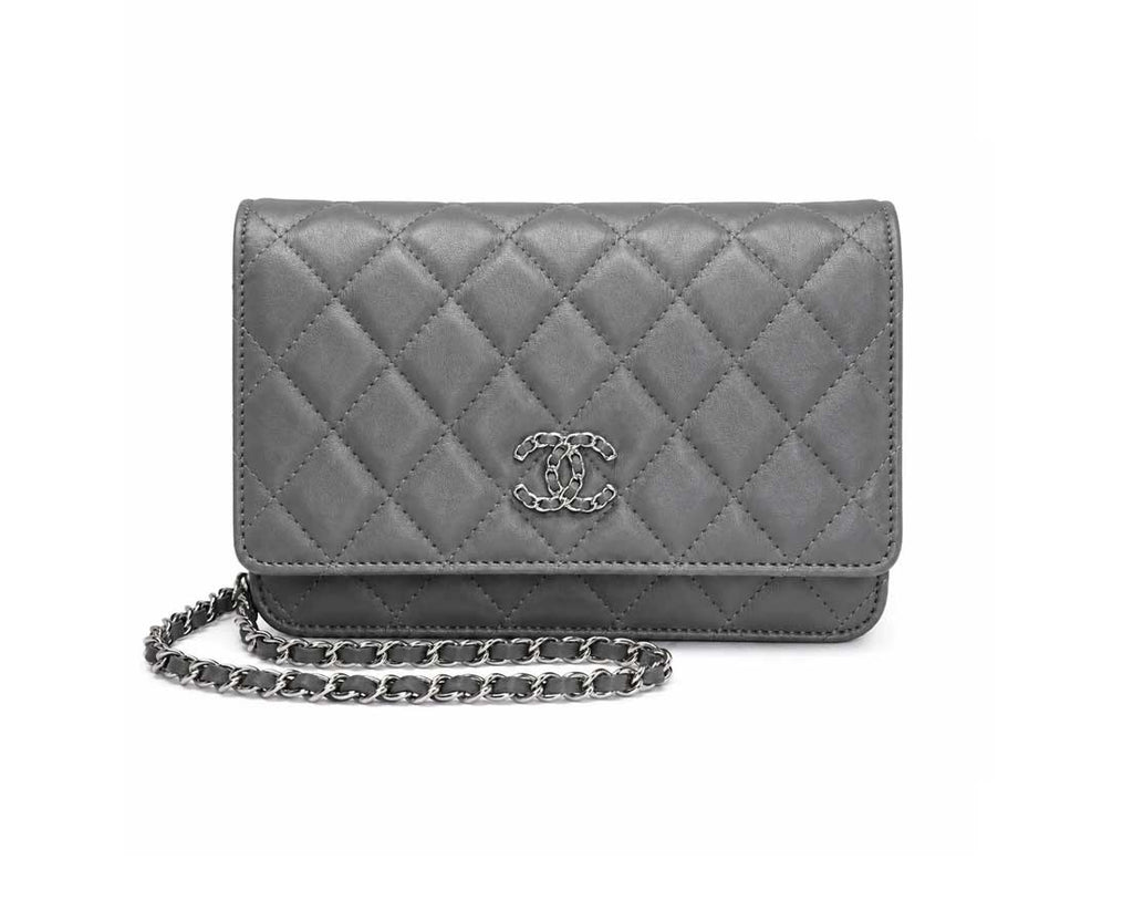 A gray quilted leather wallet with a silver-tone interlocking CC logo and a matching gray chain strap, shown on a plain white background.