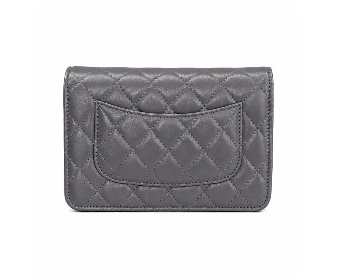 A gray quilted leather wallet with a silver-tone interlocking CC logo and a matching gray chain strap, shown on a plain white background.