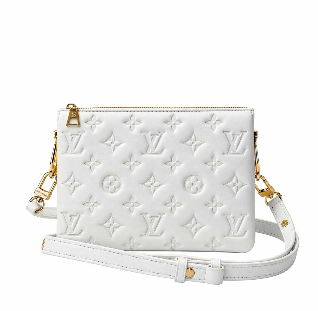 A white embossed Louis Vuitton shoulder bag with a signature monogram pattern and a chunky gold chain strap, shown against a plain white background.