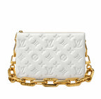 A white embossed Louis Vuitton shoulder bag with a signature monogram pattern and a chunky gold chain strap, shown against a plain white background.