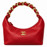 A red quilted leather shoulder bag with a gold-tone interlocking CC logo on the front and a braided chain handle, shown on a plain white background.