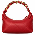 A red quilted leather hobo shoulder bag with a gold-tone chain-link handle, shown against a plain white background.