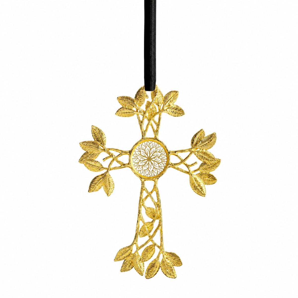 A gold cross ornament with an intricate leafy design and a central floral motif, hanging from a black ribbon against a plain white background.