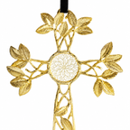A gold cross ornament with an intricate leafy design and a central floral motif, hanging from a black ribbon against a plain white background.