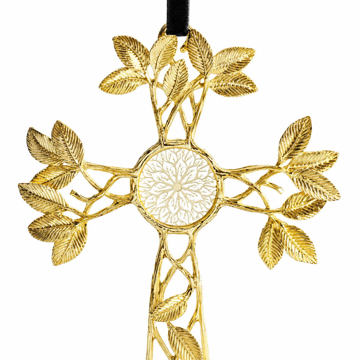 A gold cross ornament with an intricate leafy design and a central floral motif, hanging from a black ribbon against a plain white background.